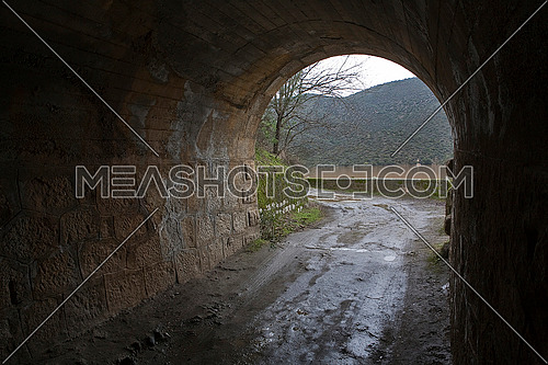 Reservoir Jndula, tunnel excavated in the mountain of granite and slate in the reservoir of Jandula, Jaen, Spain